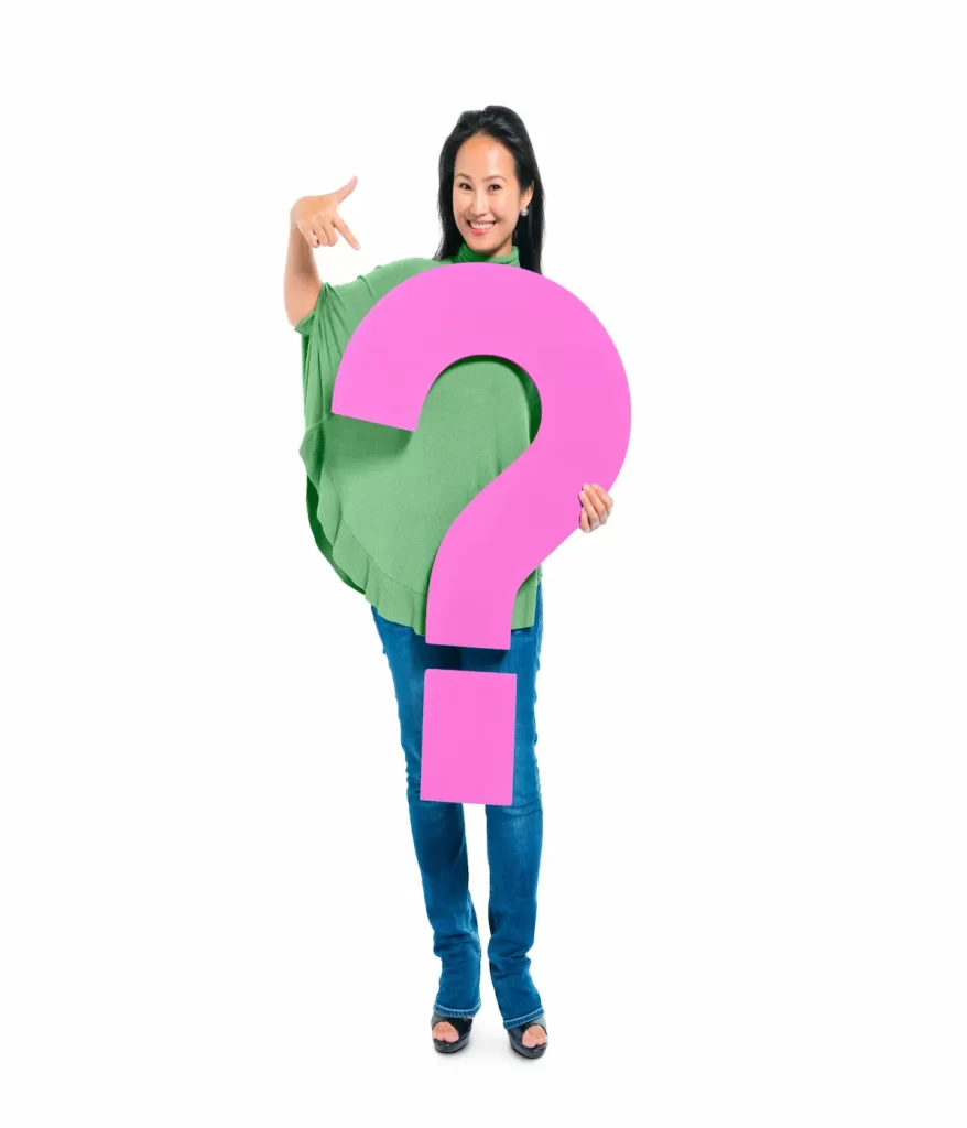 confident young woman holding pointing question mark